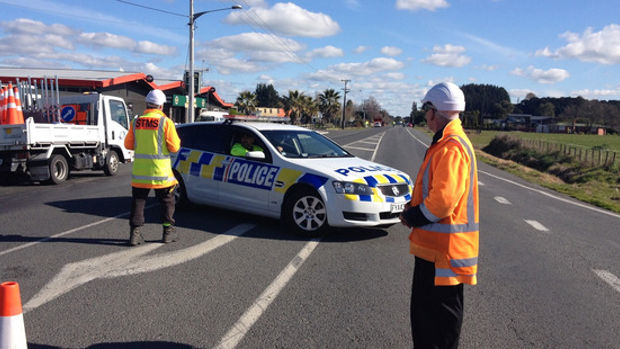 Contractors at the scene of an accident involving a car and a pedestrian at Morrinsville in the Waikato. Photo / David Kerr