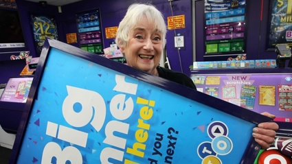  Annie Belk, "the Lotto girl" at Unichem Stortford Lodge, was delighted to hear that someone who bought a ticket there is now $8.1 million better off. Photo / Duncan Brown