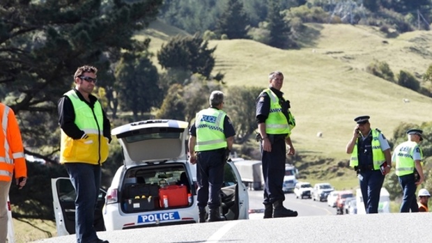 Police and emergency services at the scene of the fatal crash near Te Pohue, west of Napier. Photo / Paul Taylor