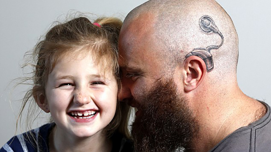 Amazing dad gets tattoo to match his daughter's hearing aid