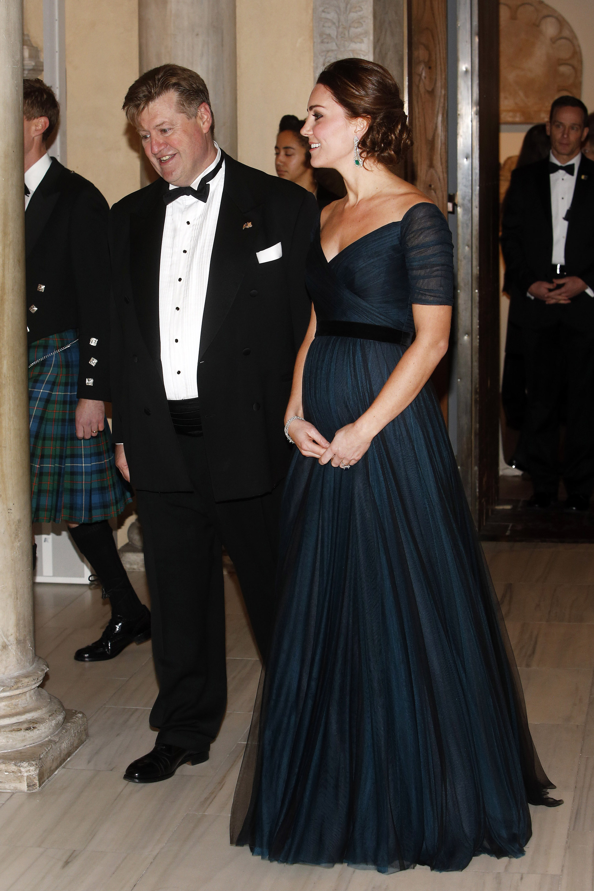 3. On December 9, 2014, Kate dazzled in an off-the-shoulder dress with an empire waist to the St. Andrews 600th Anniversary Dinner at the Metropolitan Museum of Art in New York City. The black velvet belt she accessorised the dress with perfectly accentuated her baby bump.