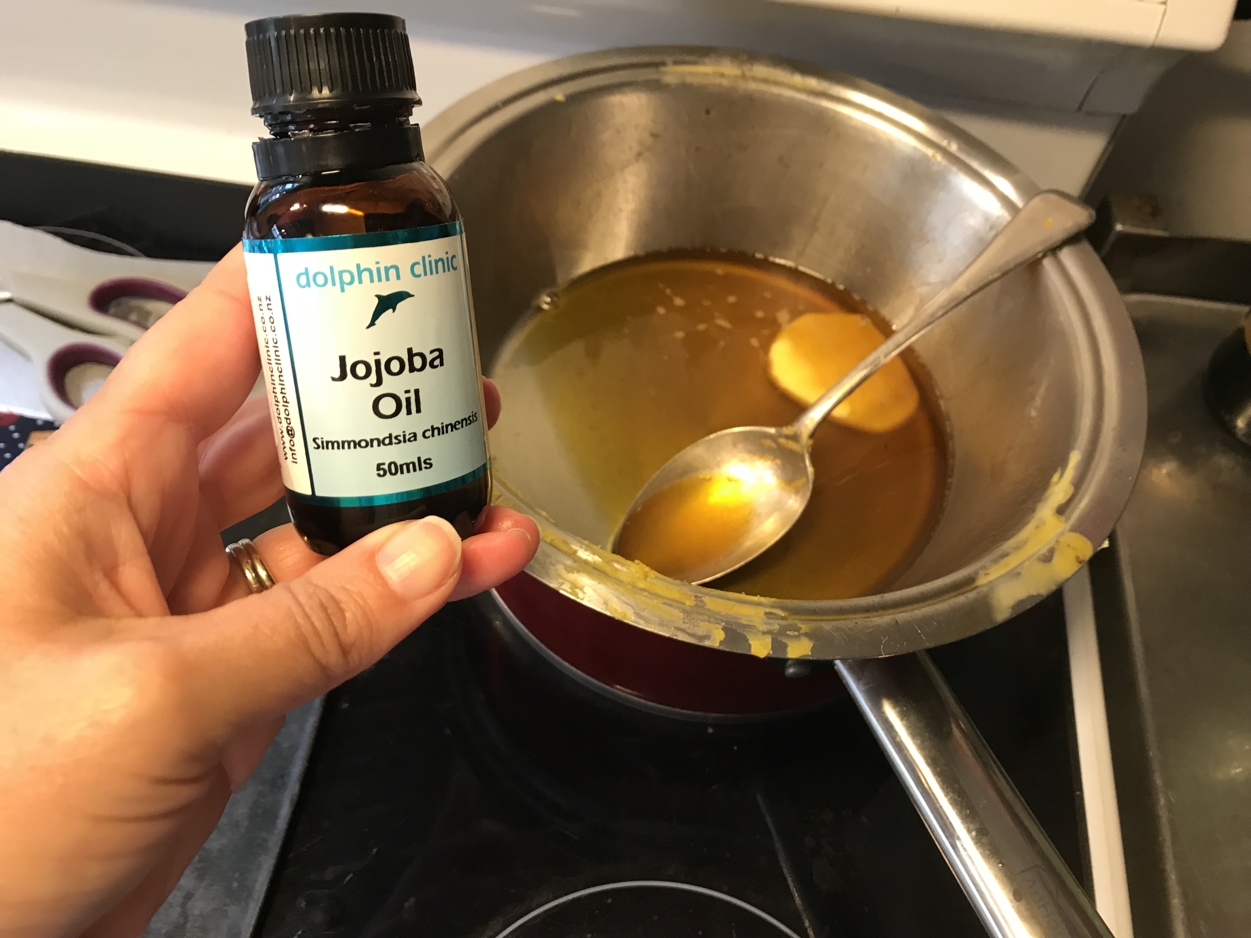 Double boiler (bowl over boiled water) adding couple of teaspoons of jojoba oil to beeswax. This apparently helps keep the wraps pliable
