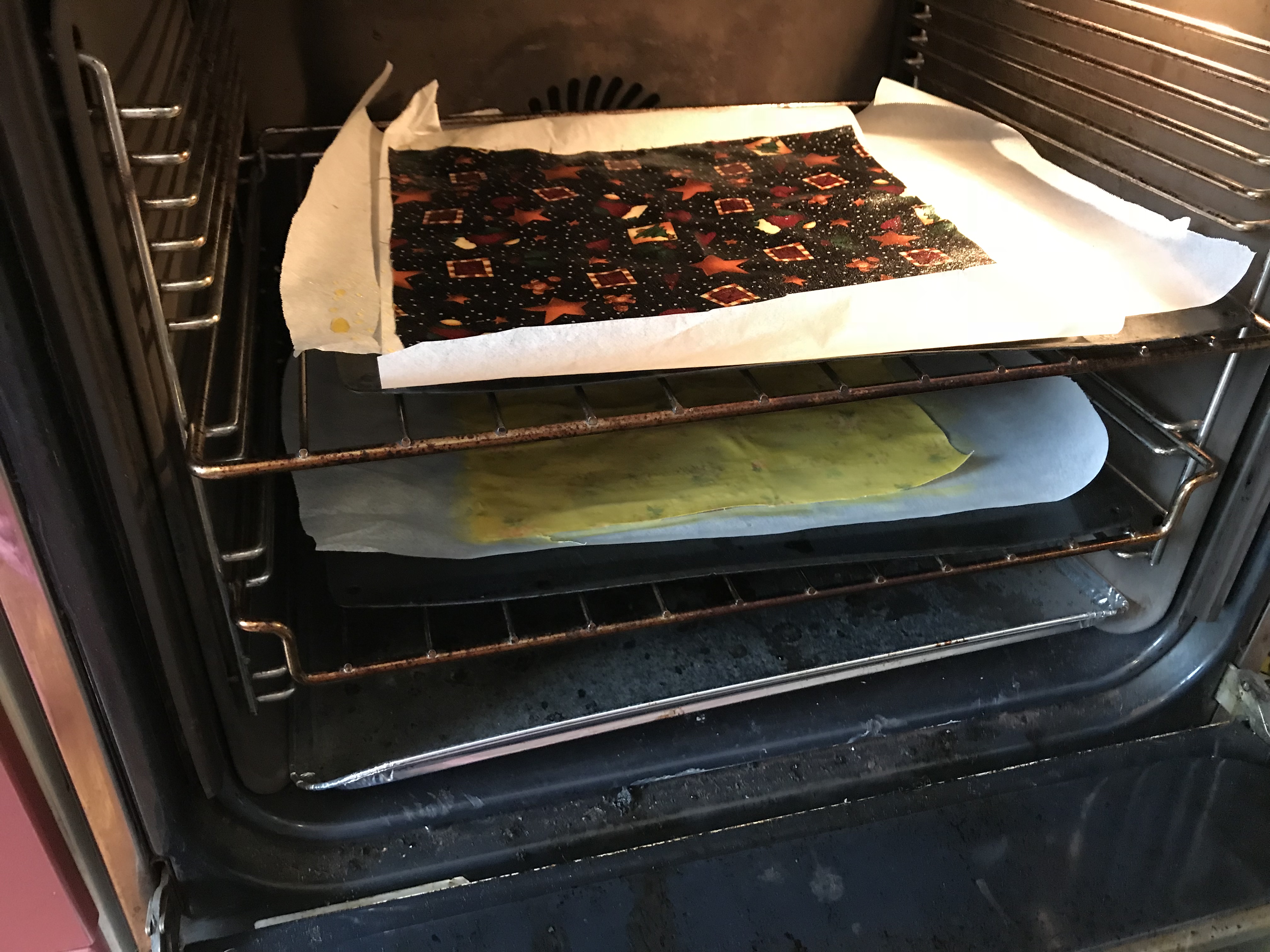 Baking - well keeping the wax melted actually, so you can take the sheets out and spread more evenly.