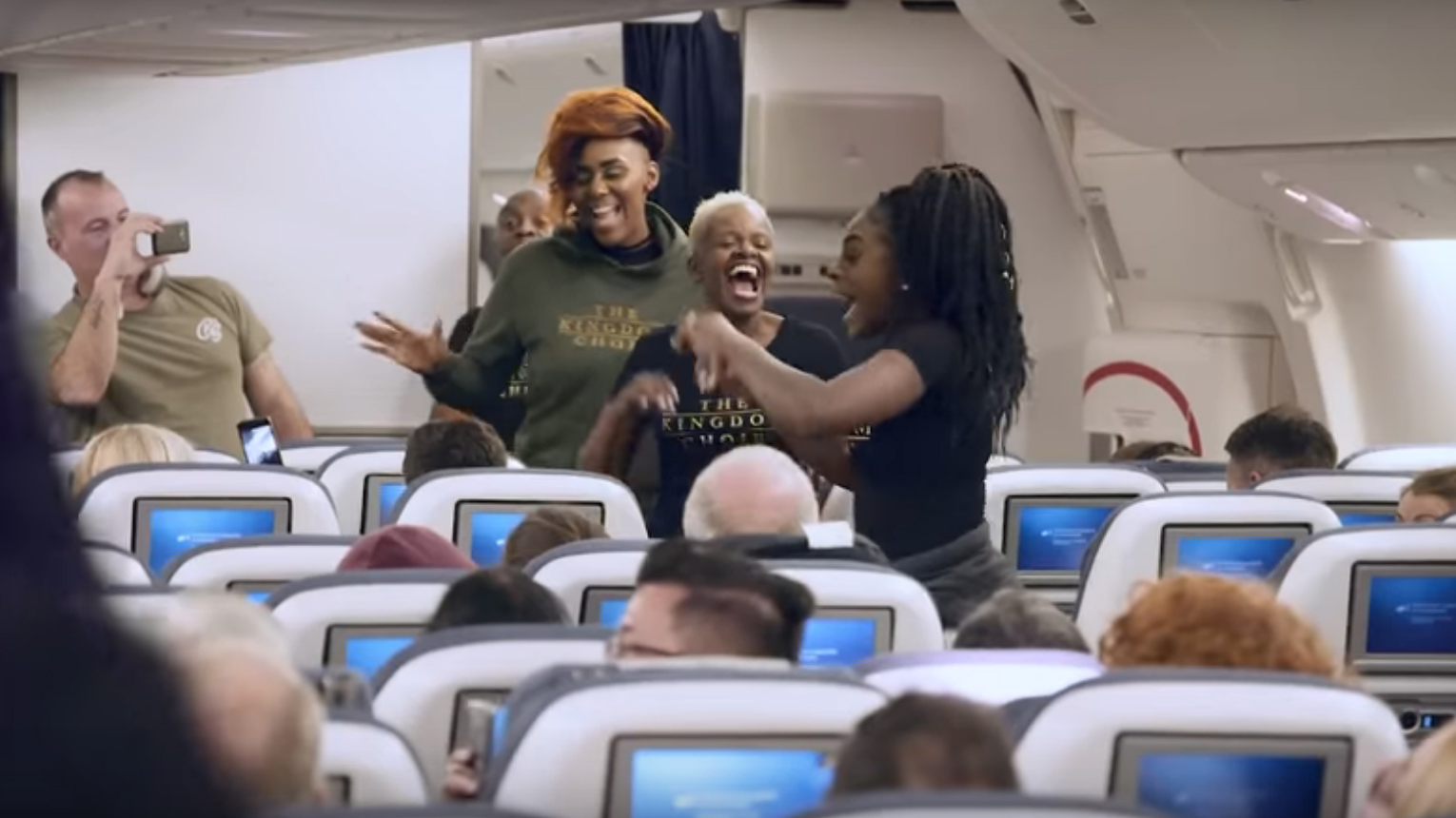 Royal wedding gospel choir surprises airplane passengers with STUNNING a cappella flash mob performance of ' Stand By Me'