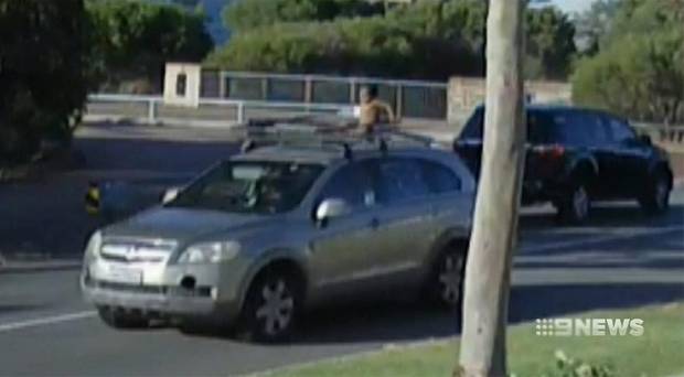 Shocking footage shows Perth mum driving with son strapped to roof rack