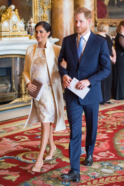 Meghan Markle wearing a metallic floral dress in March 2019. Photo / Getty
