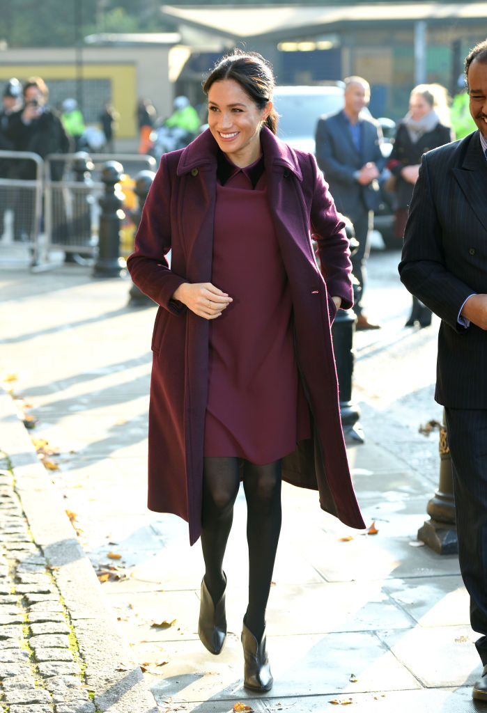 Meghan Markle wearing a maroon coat and dress in November 2018. Photo / Getty