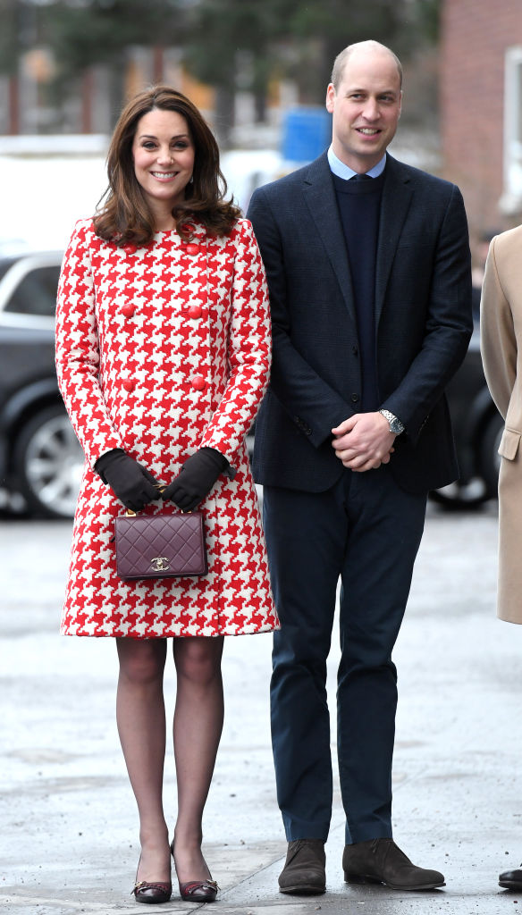 Kate Middleton wearing a red and white houndstooth coat by Catherine Walker in January 2018. Photo / Getty
