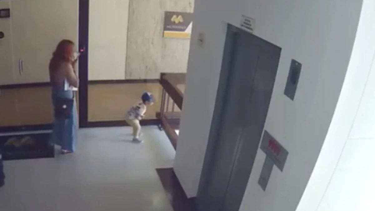 Watch the incredible moment a mum saves her child from falling off a balcony