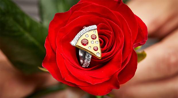 a diamond ring in the shape of a pizza