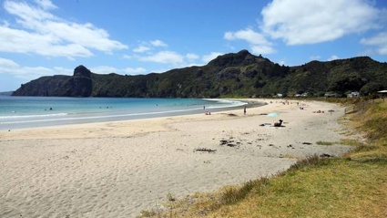 Taupō Bay is a popular surfing and family holiday destination, just north of the entrance to Whangaroa Harbour in Northland. 