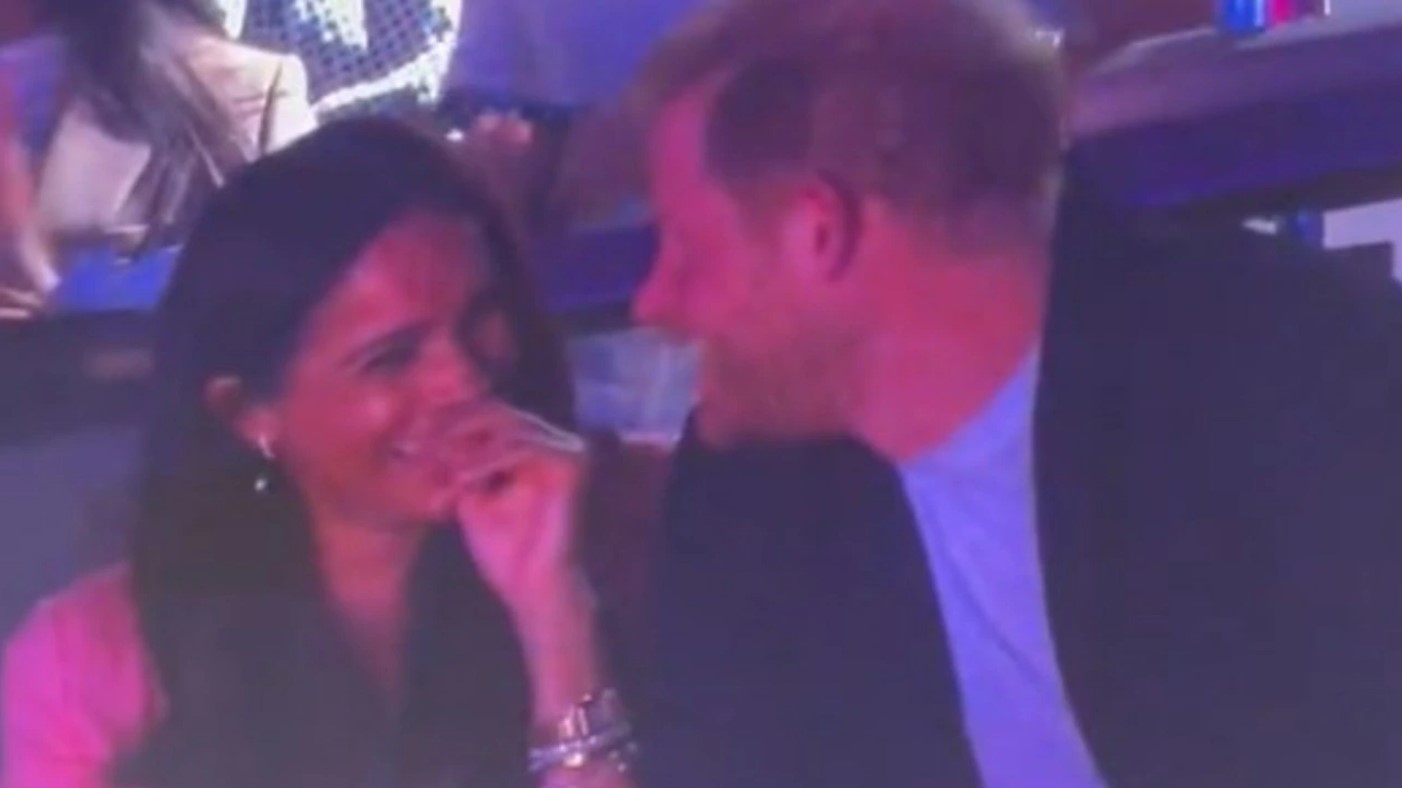 Watch the awkward moment Meghan Markle snubs Prince Harry during court-side 'kiss-cam'