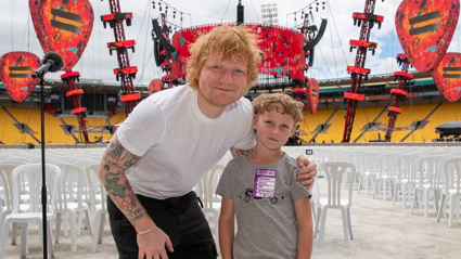 Ed Sheeran poses with young fan Graeson Gouldsmith. Photo / Mark Mitchell