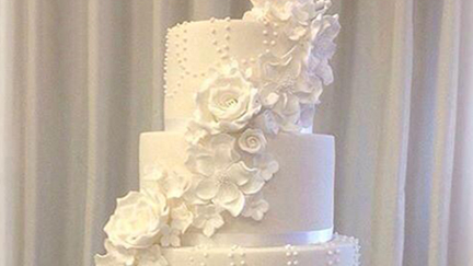 This couple's wedding cake may look normal, but it's hiding a very cool secret!