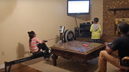 Genius dad builds rowing machine to power his kids' video games so they still exercise