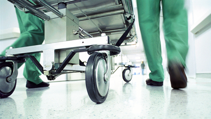 Heartwarming photo emerges of Waikato ED Doctor comforting sick mother's baby while working
