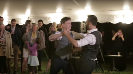 Grooms surprise their wedding guests with an EPIC 'Dirty Dancing' inspired first dance!