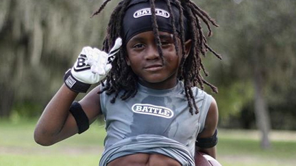 Seven-year-old with a six-pack becomes internet phenomenon in crazy videos