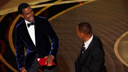 Chris Rock claps back on stage following Will Smith's public apology video